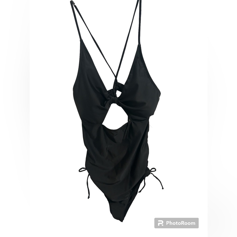 NWT plus size black sexy, one piece swim wear. One XL.